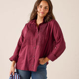 Ladies' travel-ready burgundy tuxedo button-down shirt with decorative pleating and textured detailing