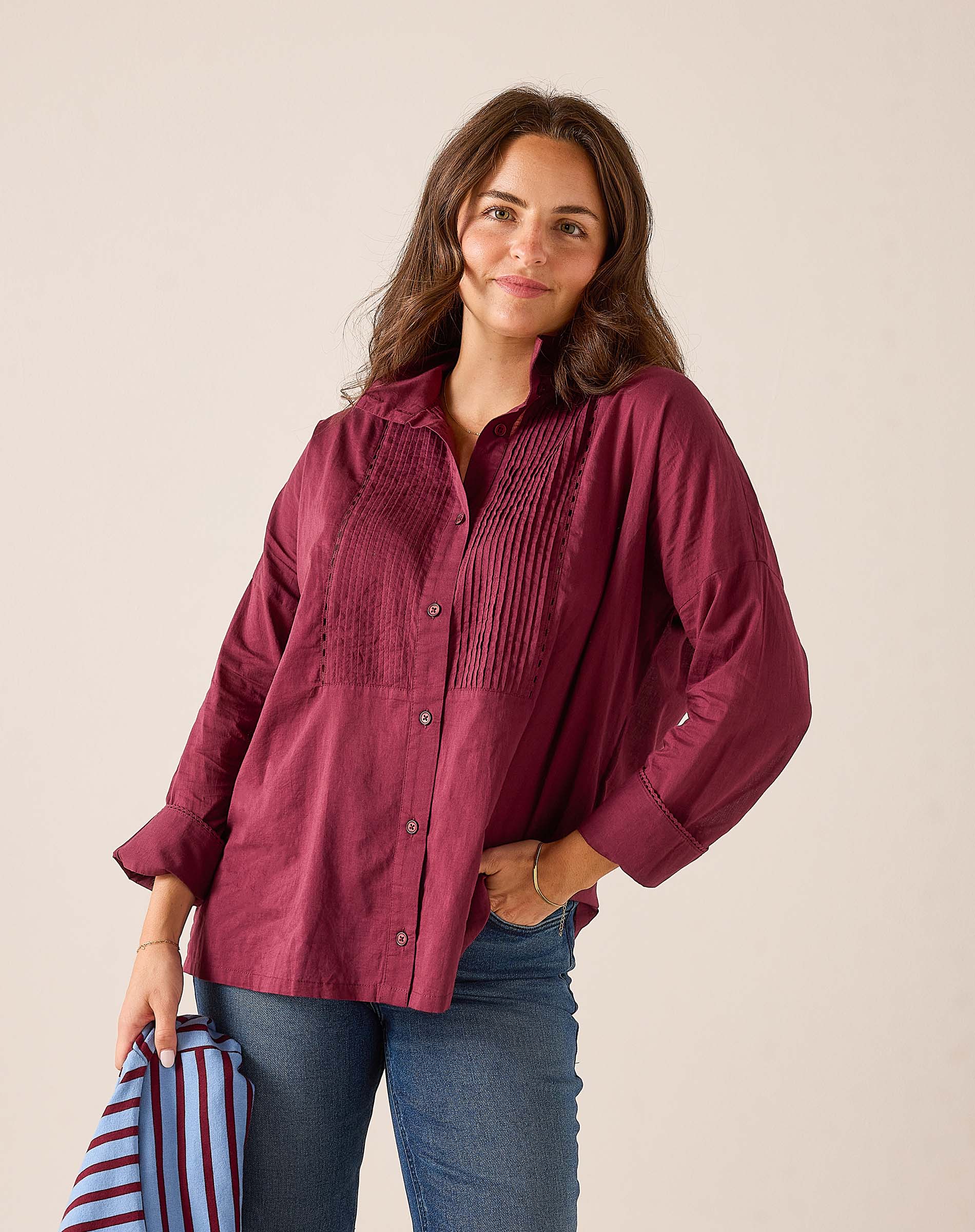 Ladies' travel-ready burgundy tuxedo button-down shirt with decorative pleating and textured detailing