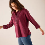 Burgundy Emerson tuxedo top featuring a gathered pleated chest detail and long sleeves.