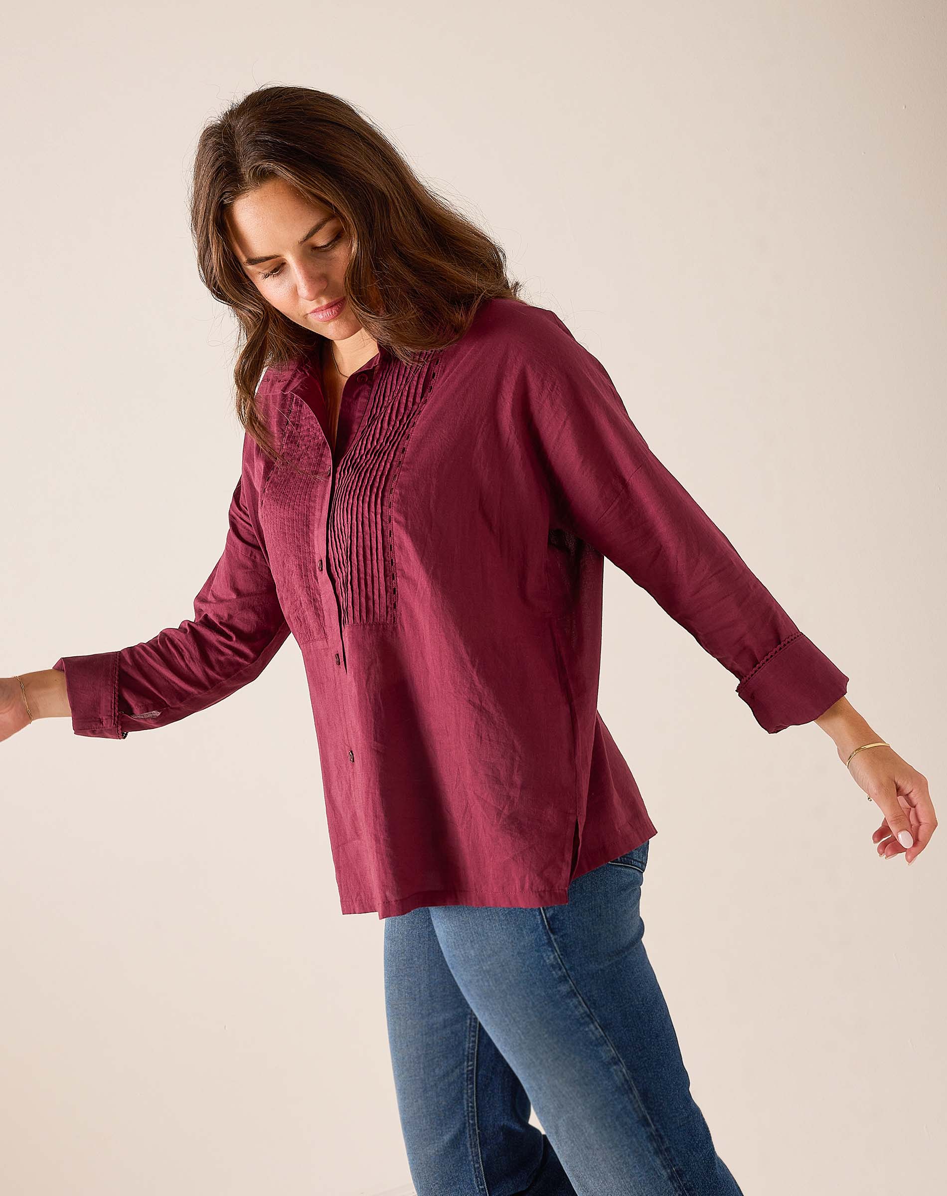 Burgundy Emerson tuxedo top featuring a gathered pleated chest detail and long sleeves.