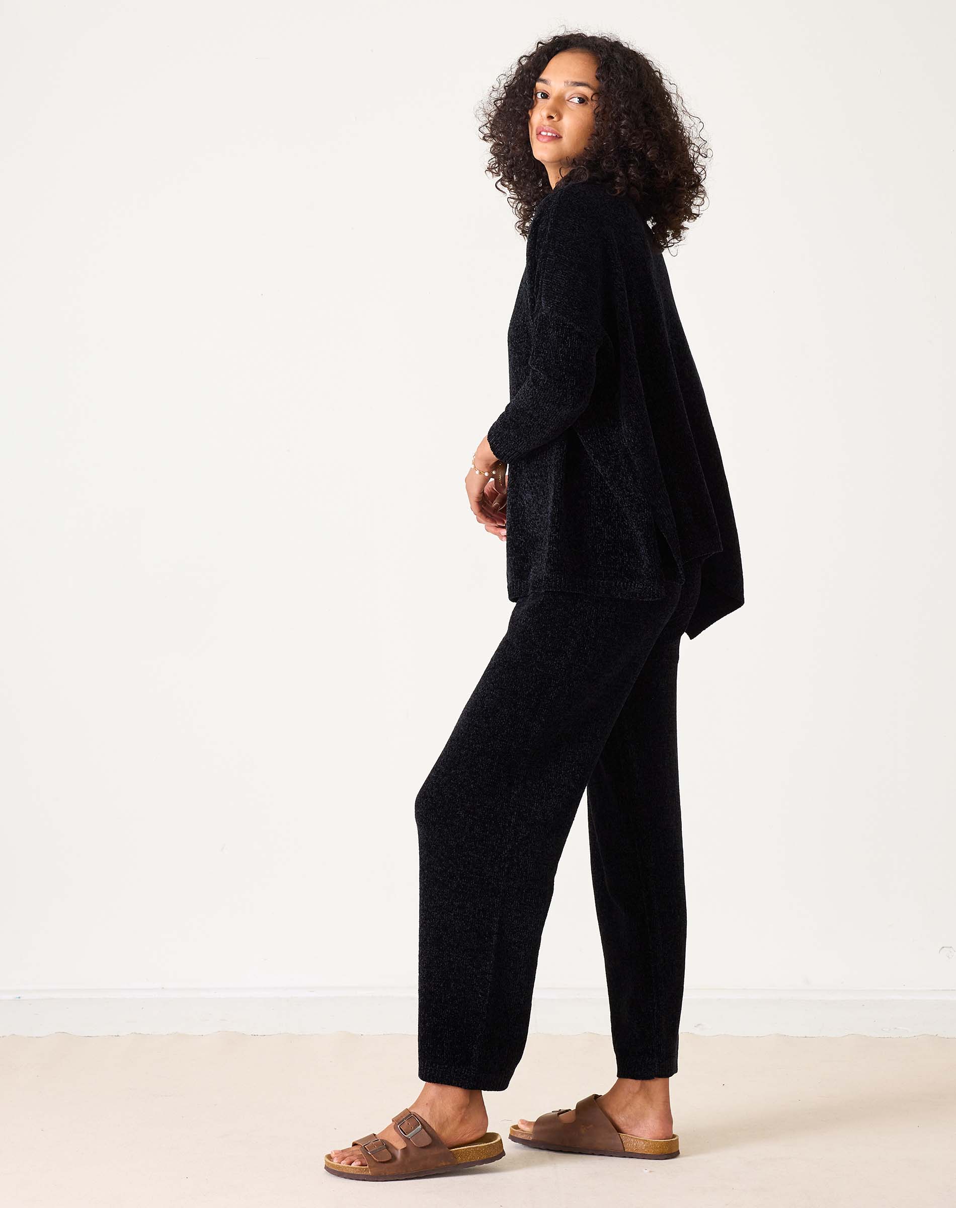 Black chenille textured pant featuring a relaxed fit and wide leg.
