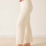 Cream chenille knit pants with a relaxed fit and soft texture.