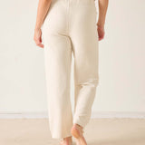 Cream chenille knit pants with a wide leg and elasticized waistband.