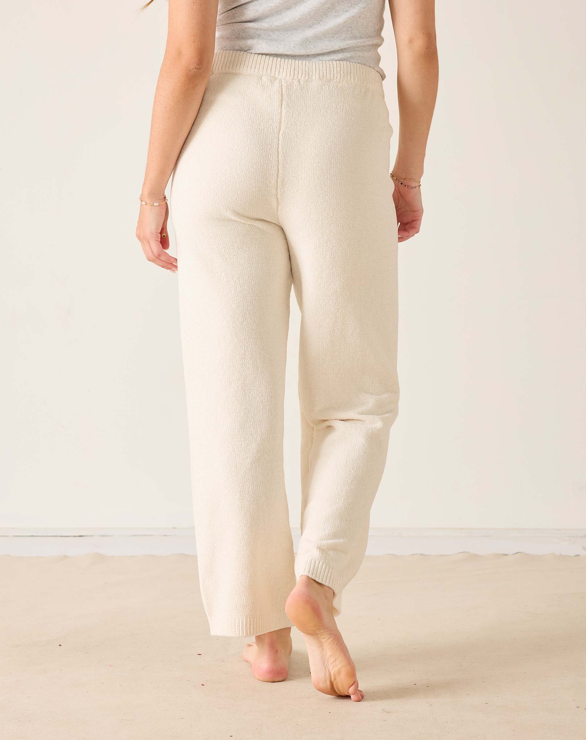 Cream chenille knit pants with a wide leg and elasticized waistband.