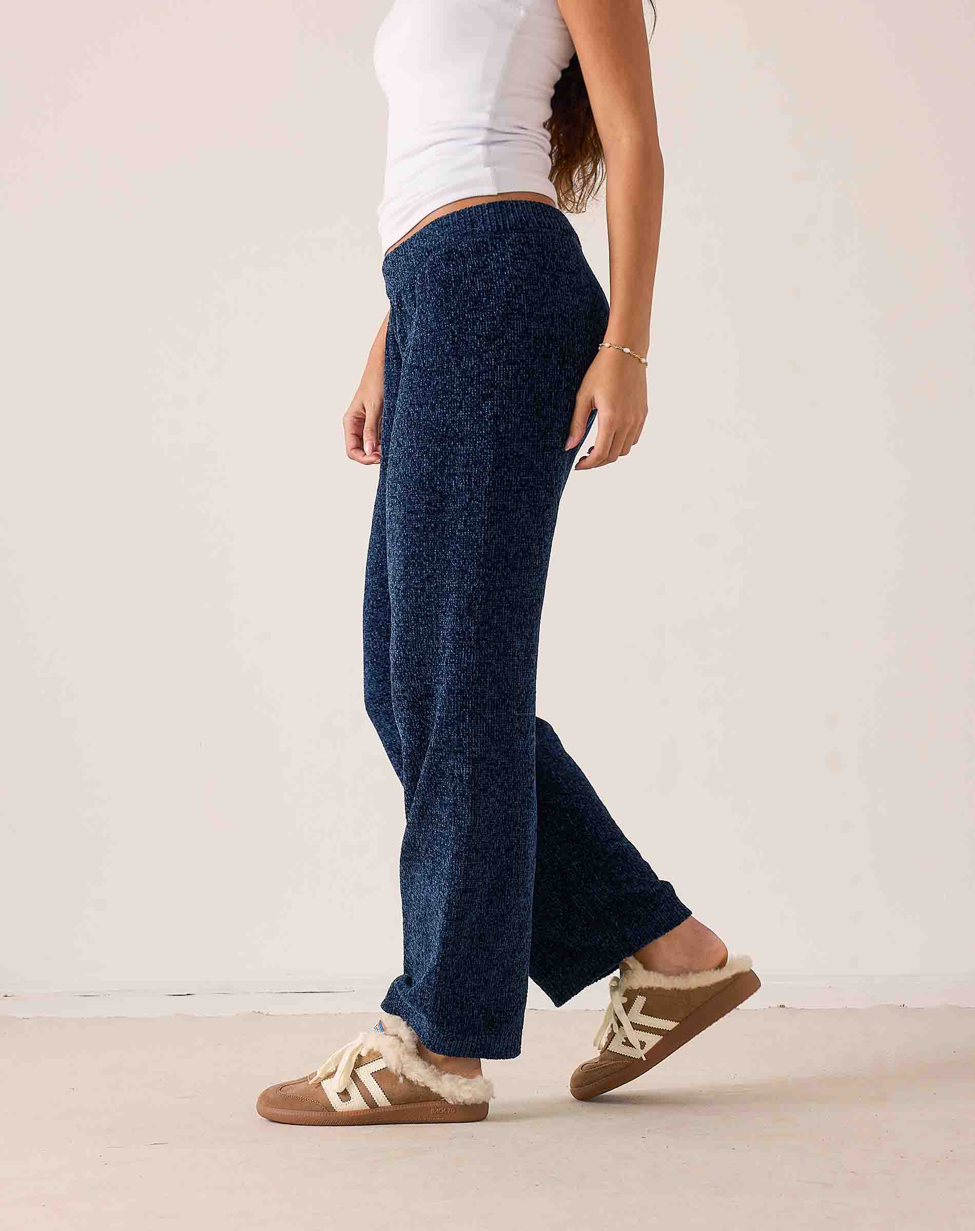 Navy blue chenille knit pants with wide legs and a relaxed fit.