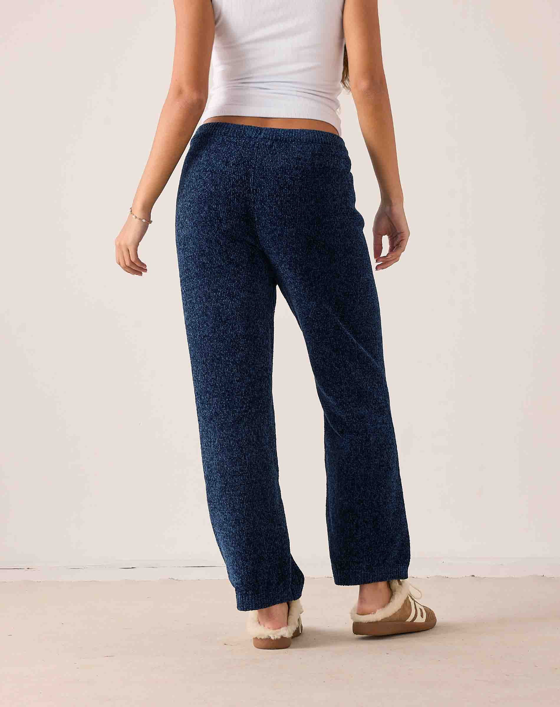 Navy blue chenille knit pants with a relaxed fit and wide-leg silhouette.
