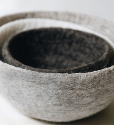 Three grey nested felt bowls. See the heartfelt collection.