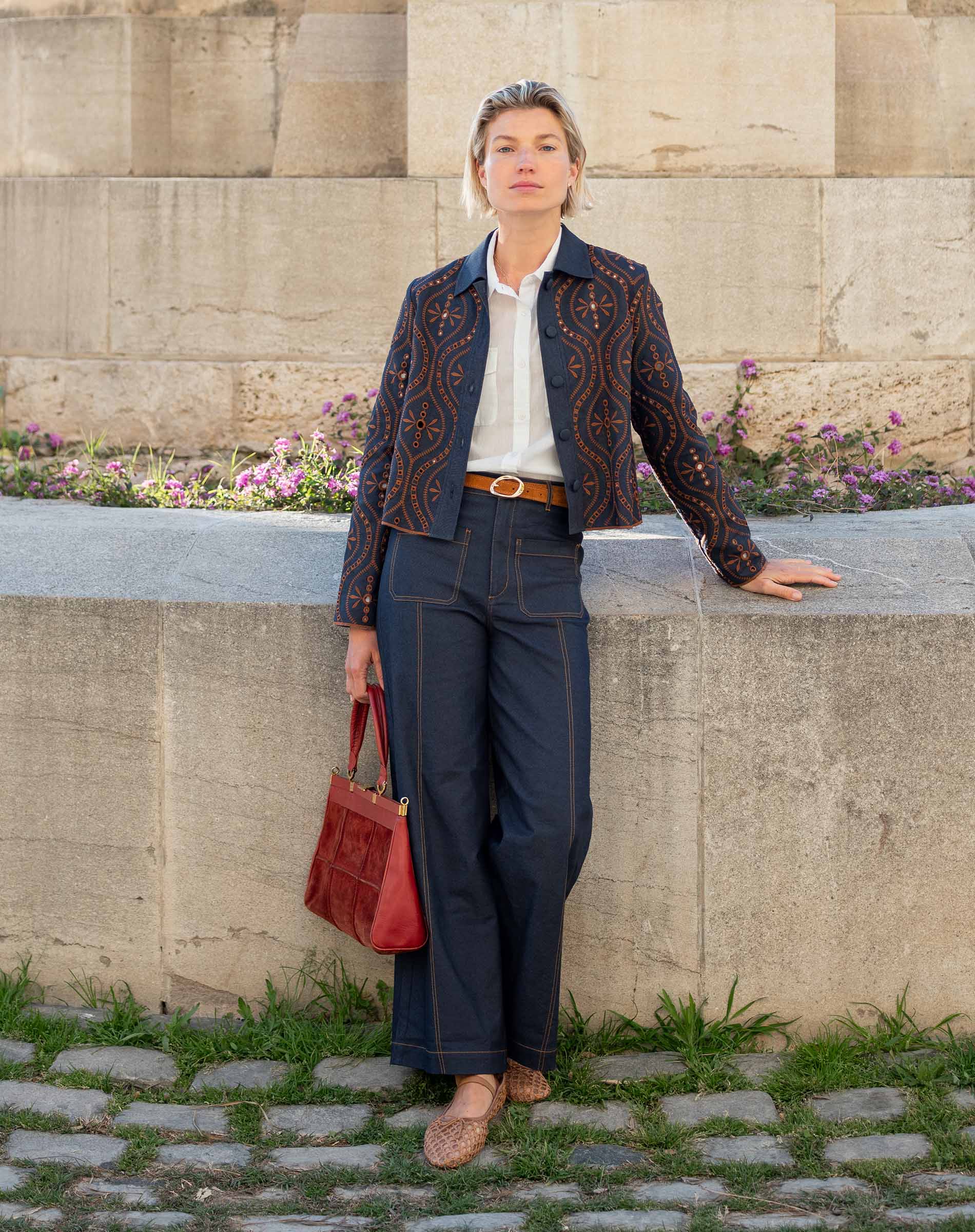 Navy blue paisley print jacket in a relaxed fit with decorative buttons.