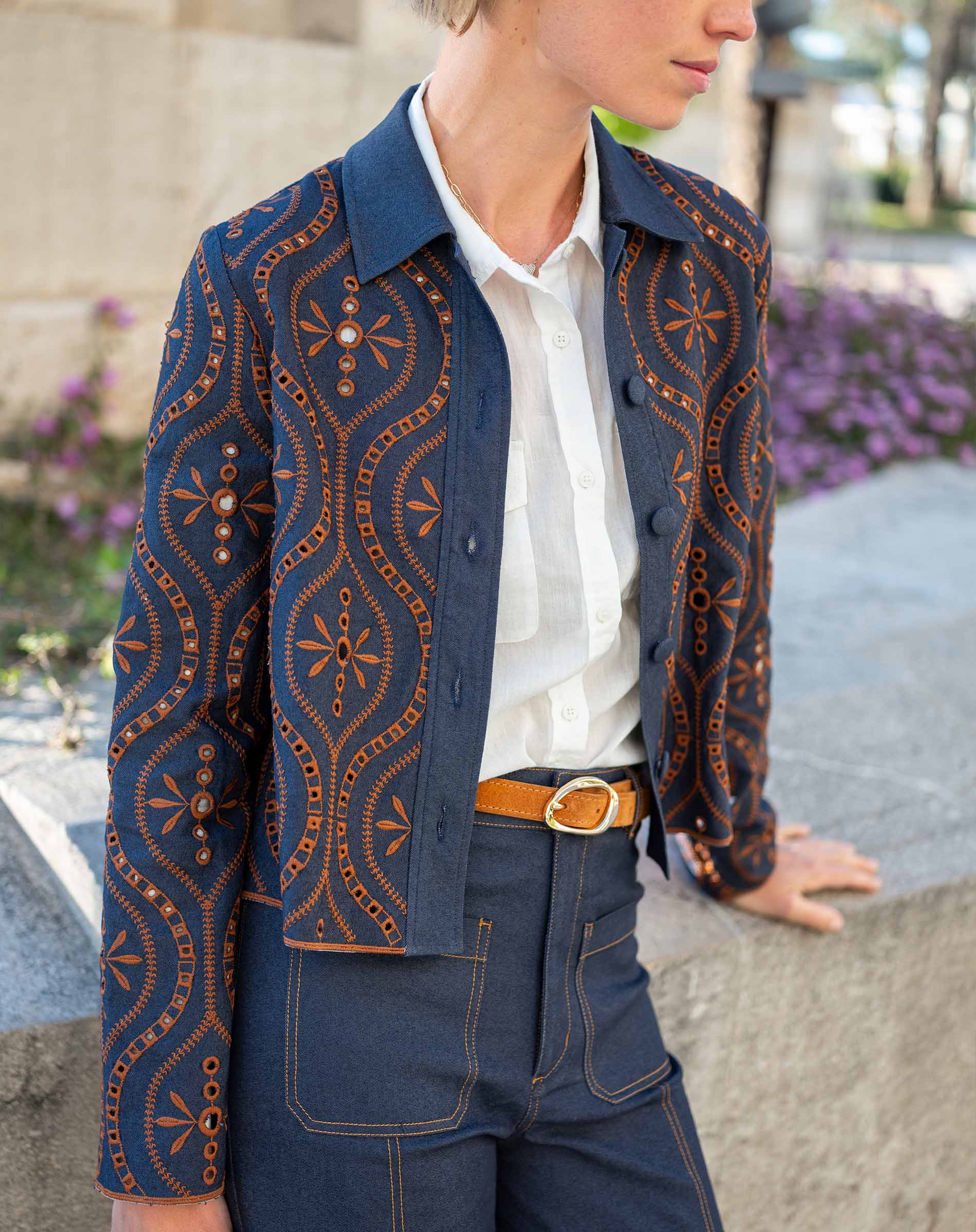 Navy blue embroidered motif jacket in rinse color.