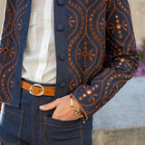 Indigo and orange geometric print bomber jacket in a soft knit fabric.