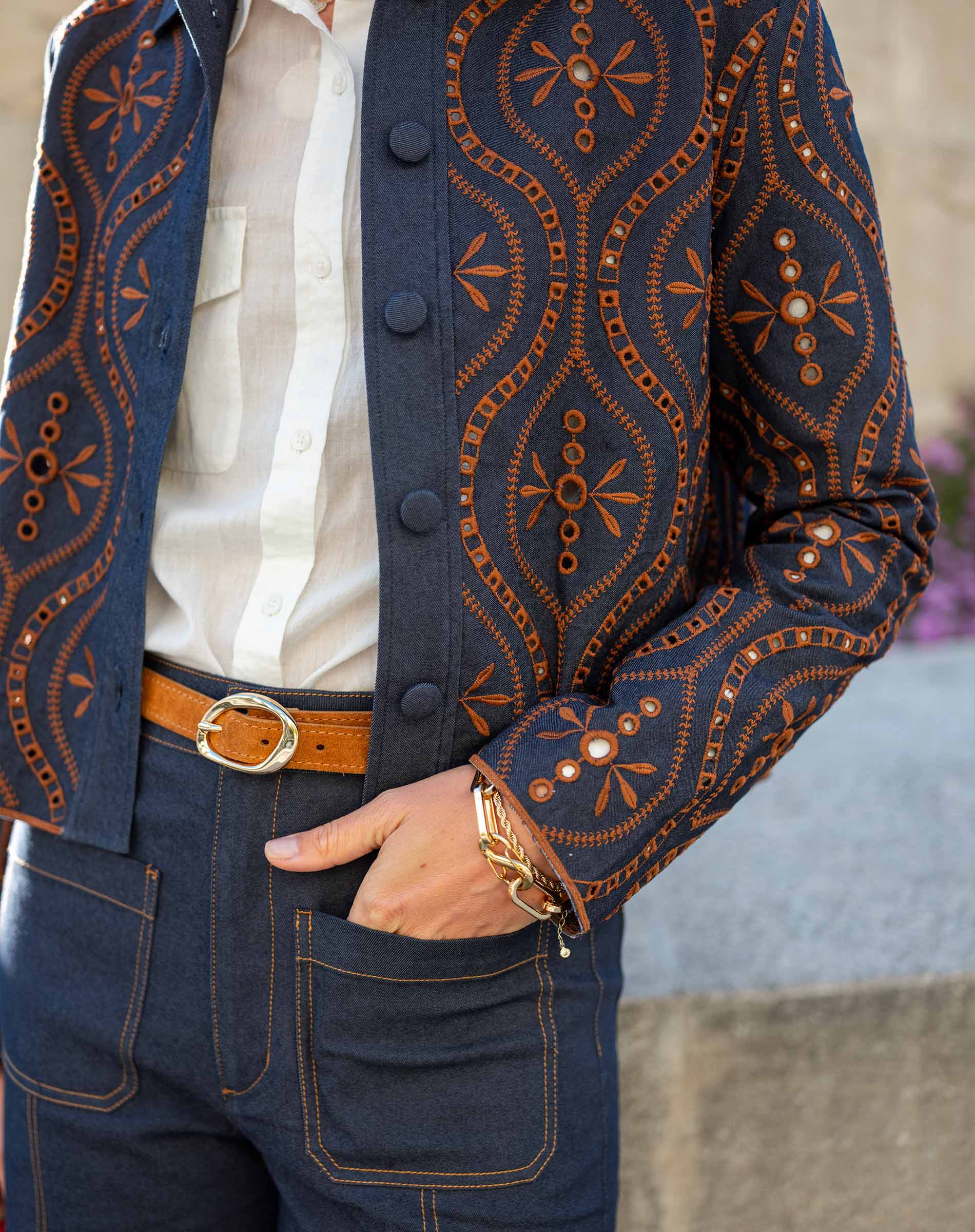Indigo and orange geometric print bomber jacket in a soft knit fabric.