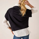 Back view of women's travel-friendly black dolman top with an oversized fit.