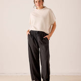 MERSEA ladies' travel-ready bone colored dolman sleeve knit top with a relaxed fit and wide sleeves.