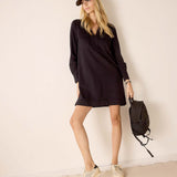 Black oversized relaxed-fit tunic dress with wide sleeves and a belt loop.