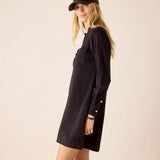 Black relaxed fit cotton dress with a front pocket and buttoned cuff details.