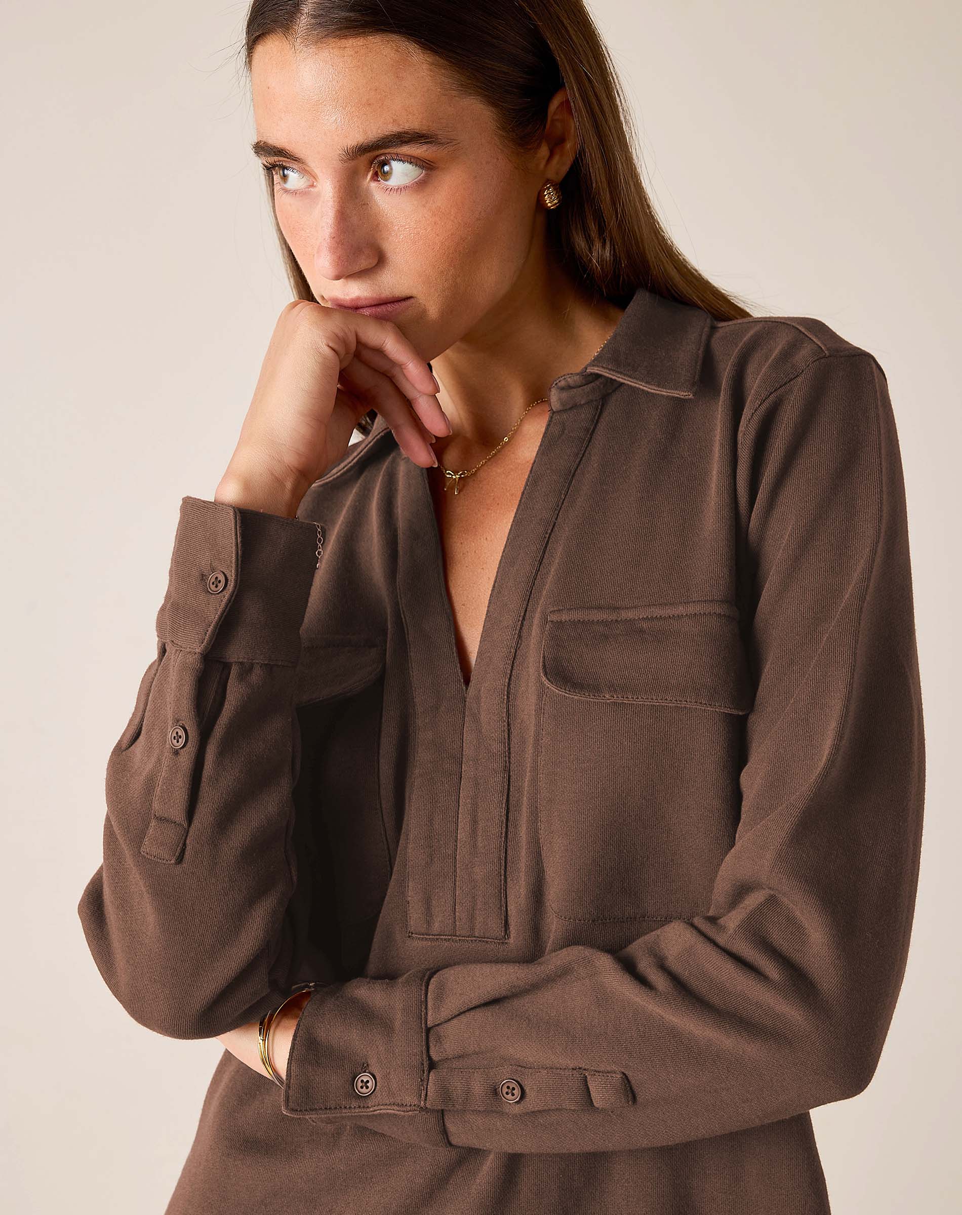 Espresso brown button-down shirt with a collar and chest pockets.