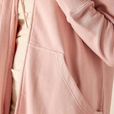 Close-up of a pink jacket with a zipper and pocket