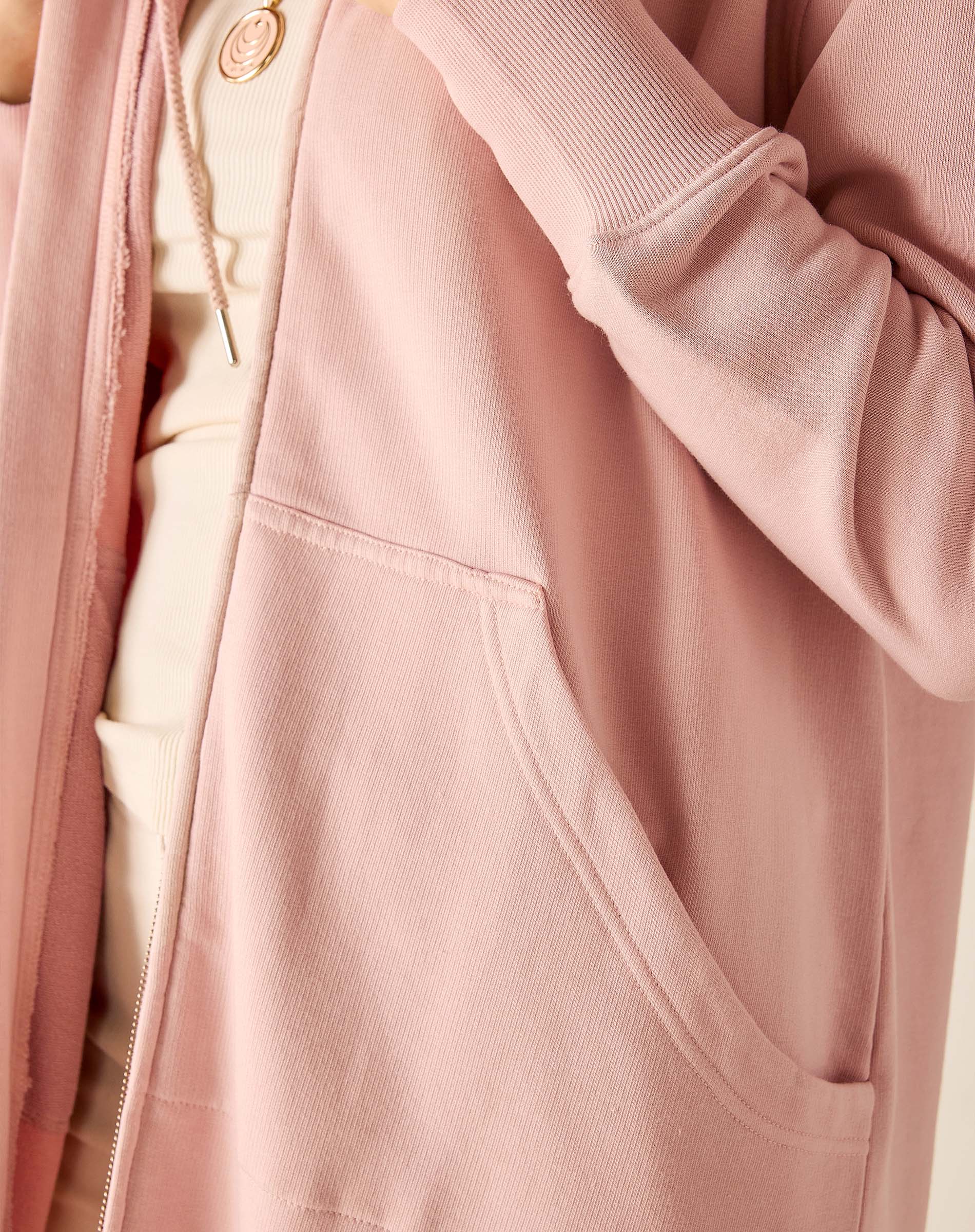 Close-up of a pink jacket with a zipper and pocket