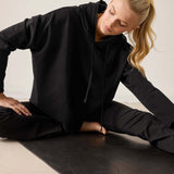 Black Frenchie hoodie with a drawstring hood and cozy knit fabric.