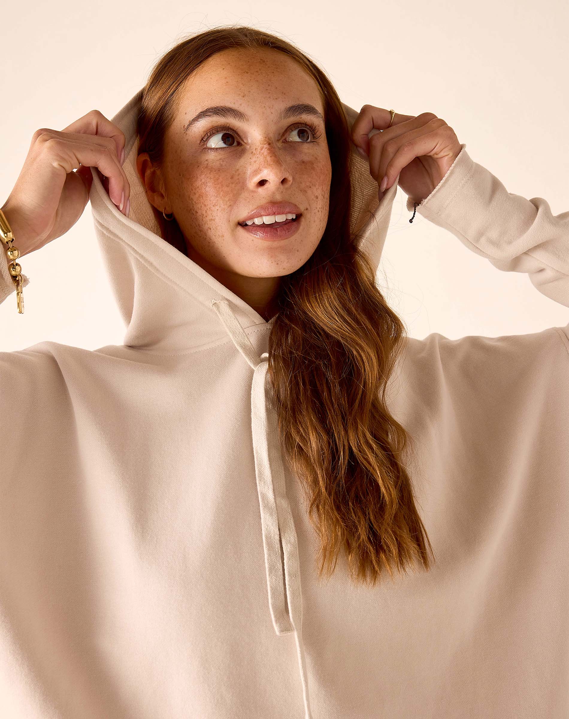 MERSEA women's travel-friendly bone hoodie with a drawstring and front pocket.
