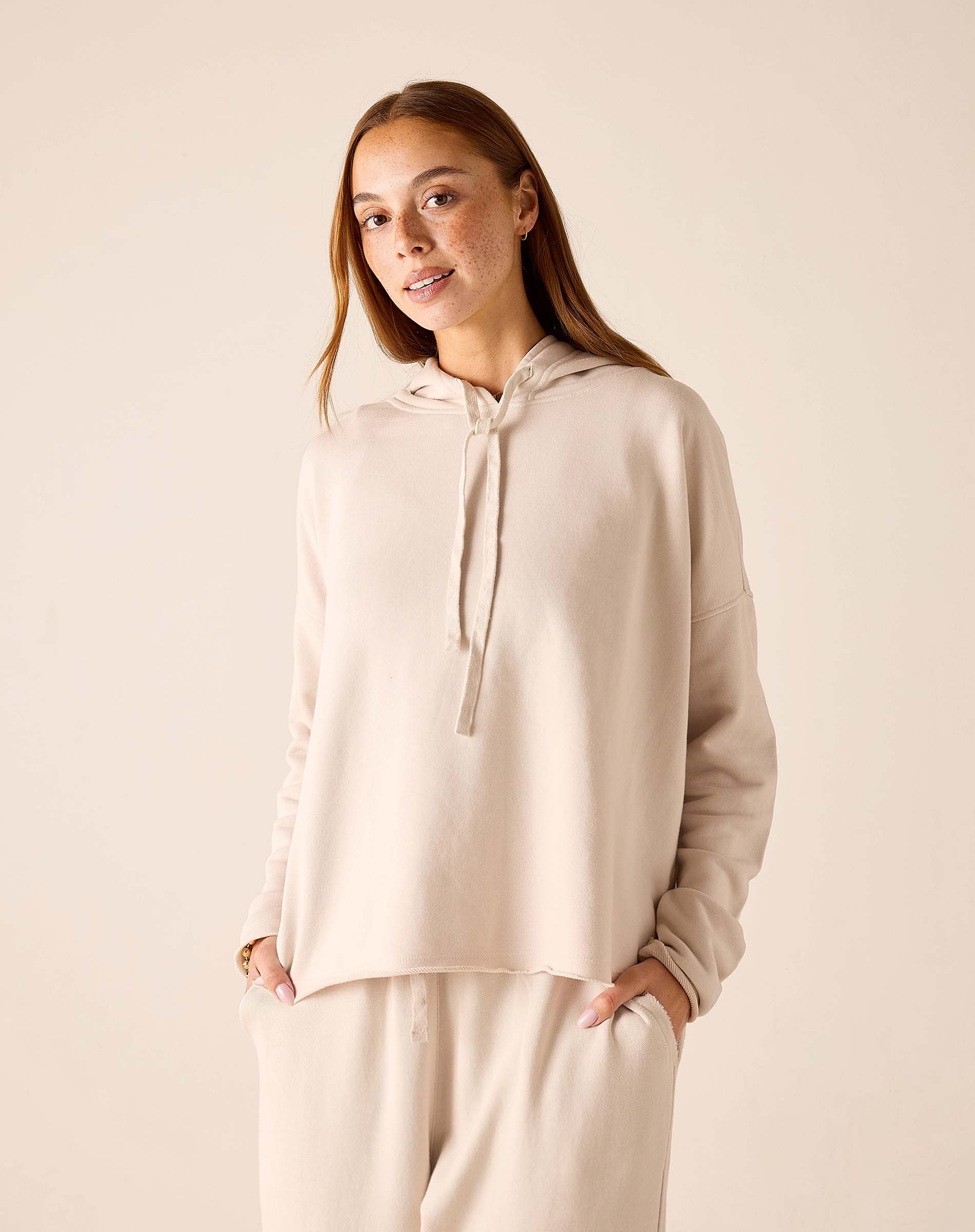 Bone hoodie with drawstring details and a relaxed fit.