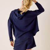 Back view of the cadet blue knit hoodie and matching shorts.