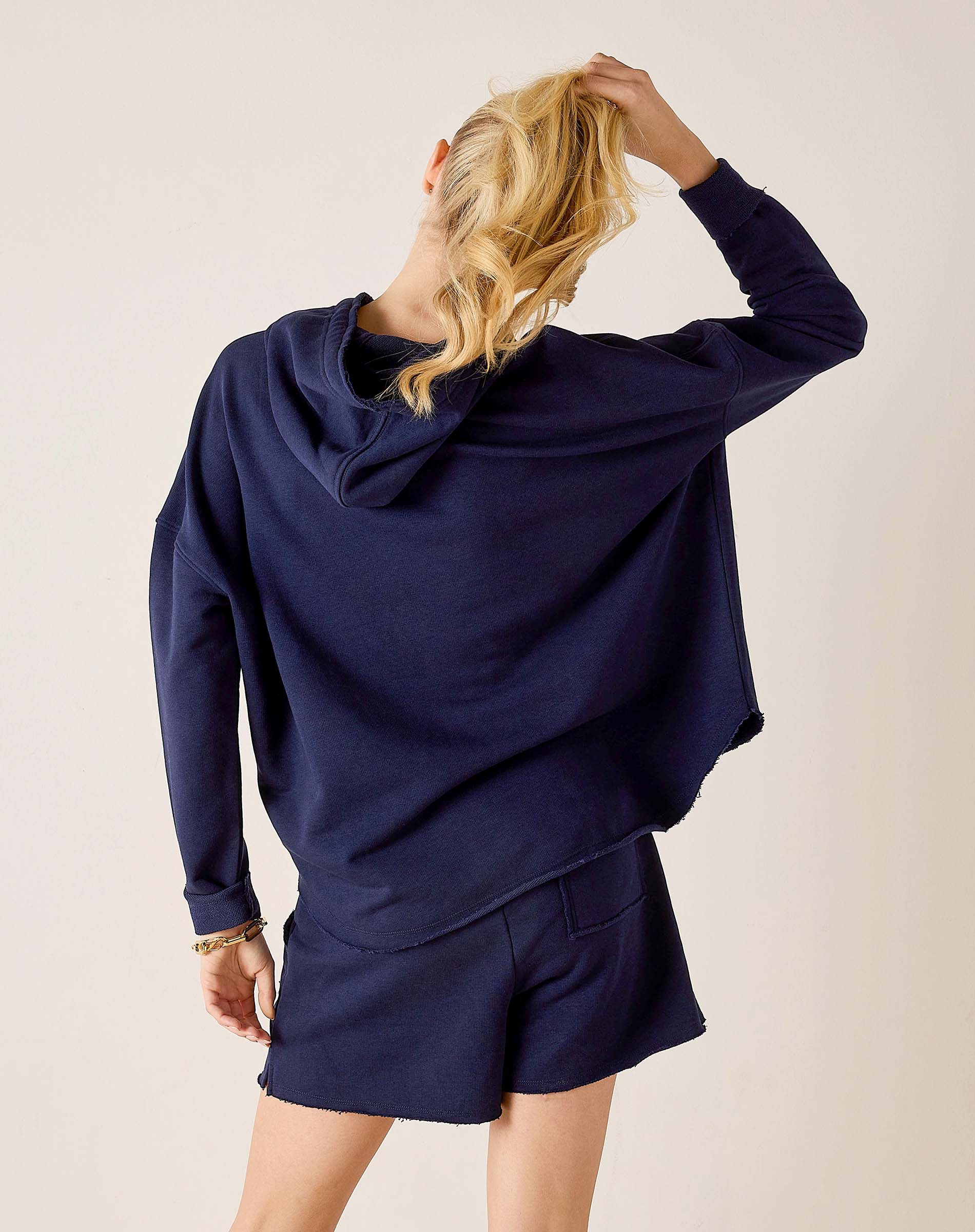 Back view of the cadet blue knit hoodie and matching shorts.