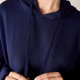 Cadet blue knit hoodie with drawstring and a relaxed fit.