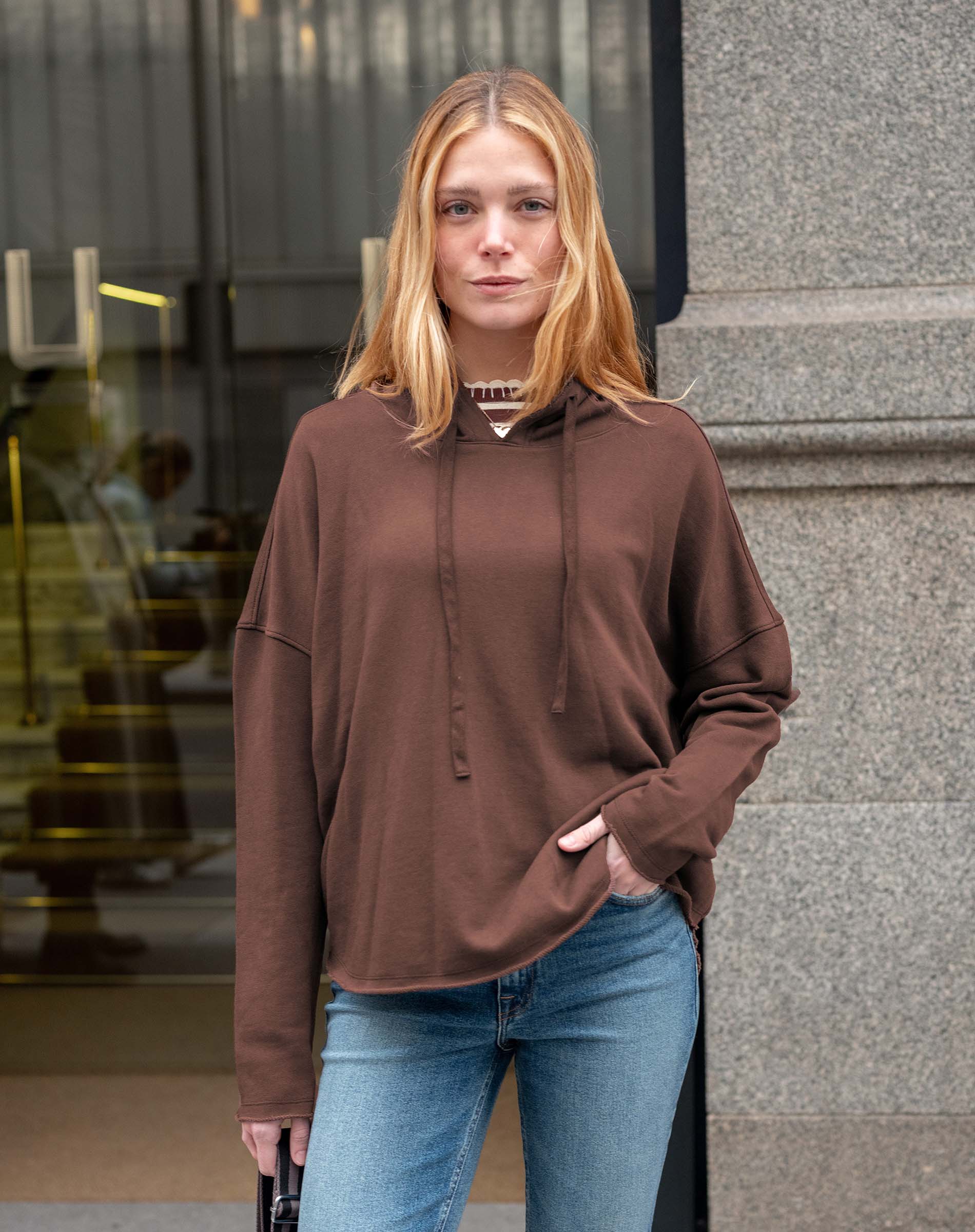 Espresso brown oversized hoodie with a drawstring and relaxed fit.