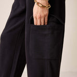 Black Frenchie jogger pants with a large front pocket and relaxed fit.
