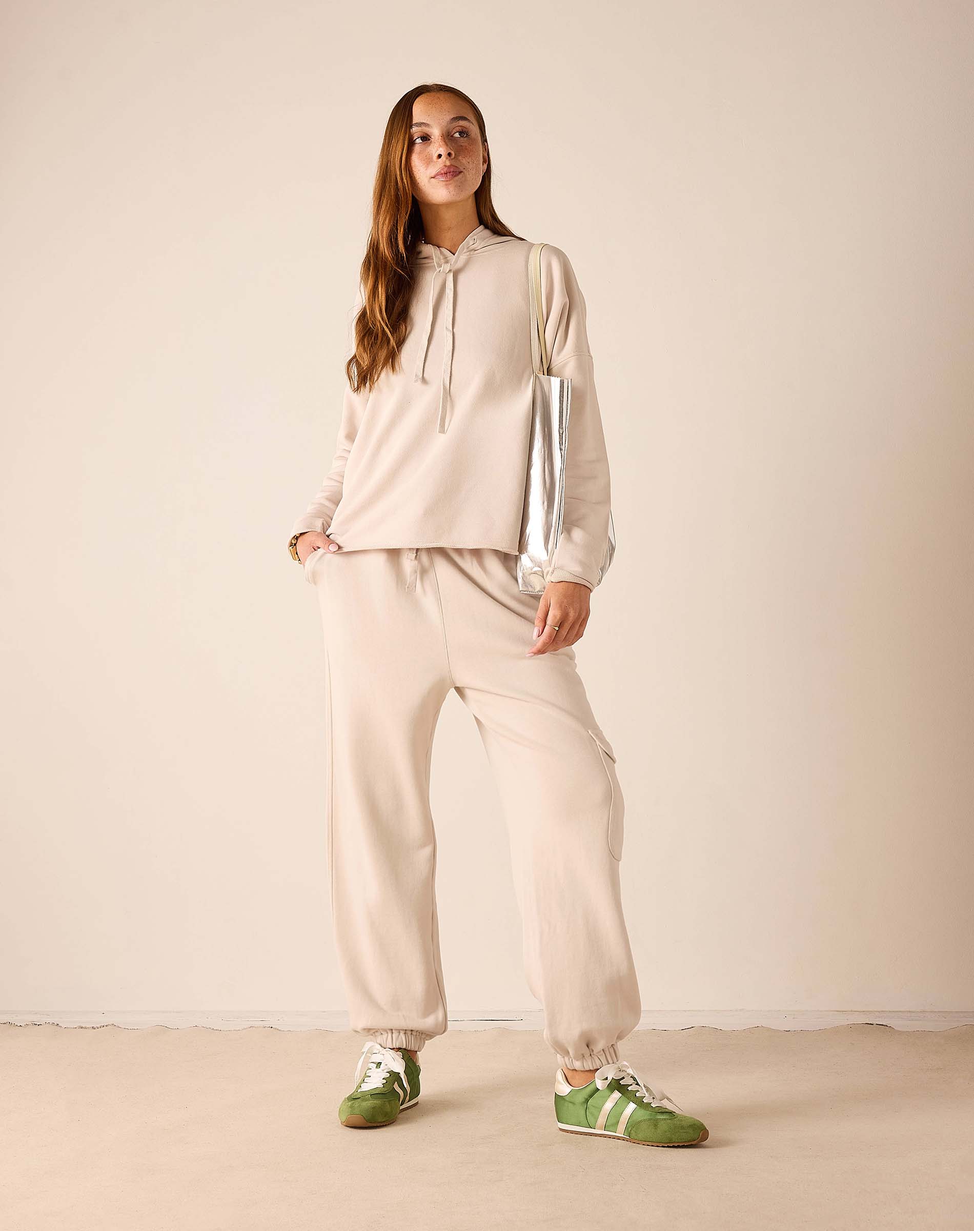 Bone hoodie and matching jogger set in a soft knit fabric.