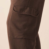 MERSEA ladies' travel-ready espresso brown jogger pants with a large front patch pocket and a center seam.