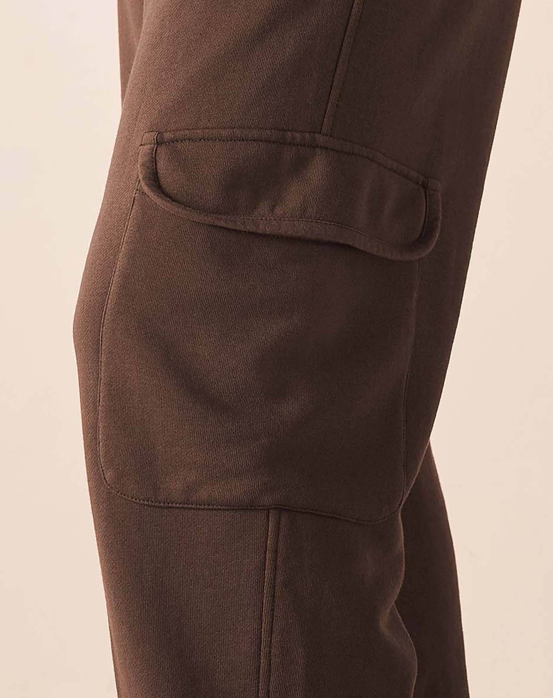 MERSEA ladies' travel-ready espresso brown jogger pants with a large front patch pocket and a center seam.