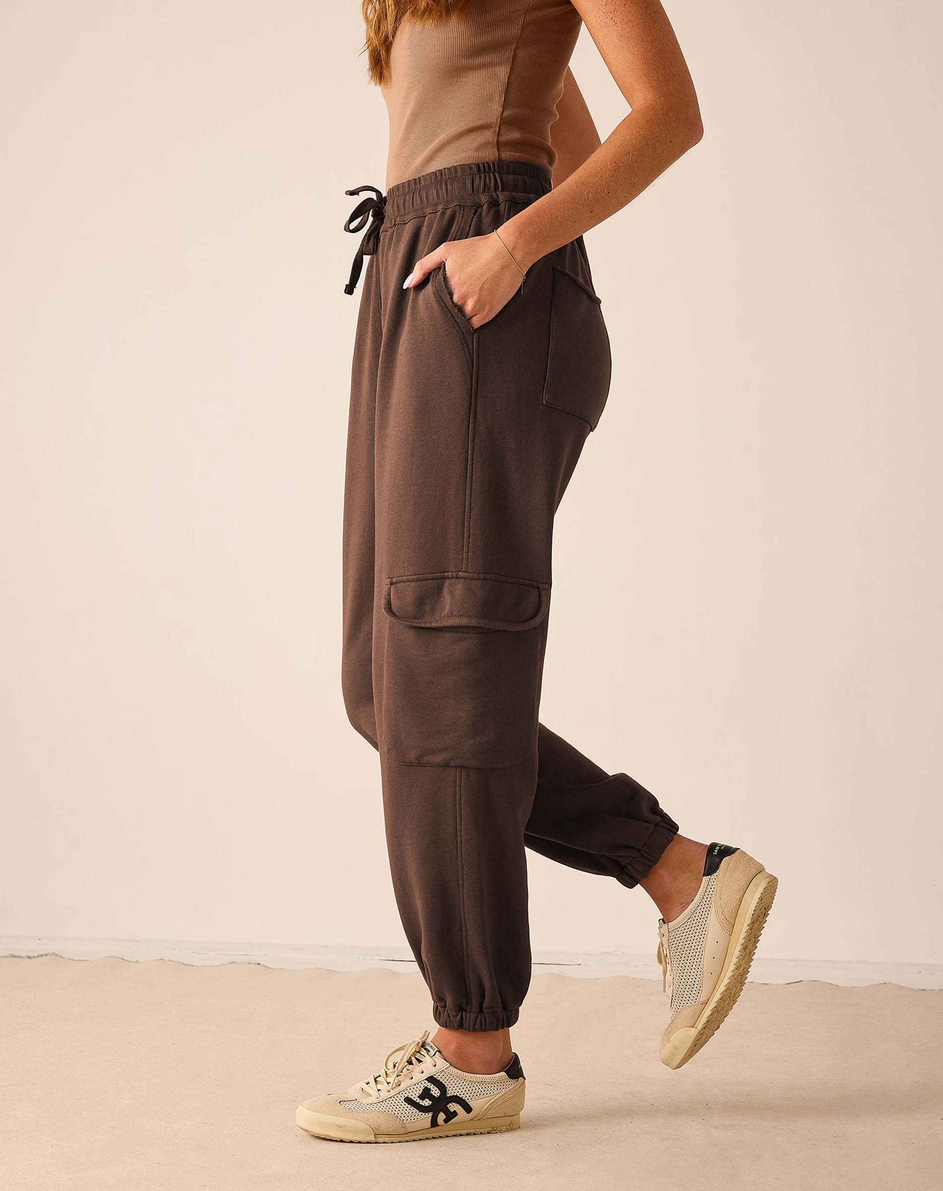 Espresso brown Frenchie joggers with elastic waist and cargo pockets.