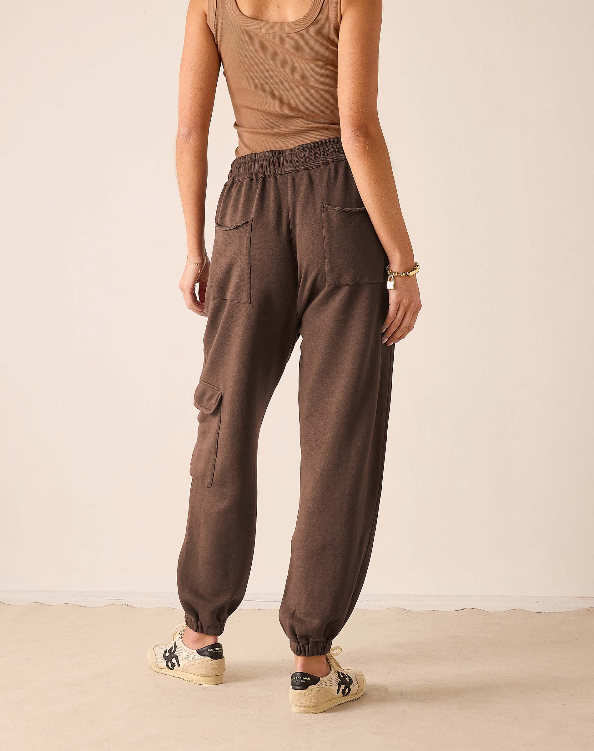 Espresso jogger pants with large front pockets and gathered hems.