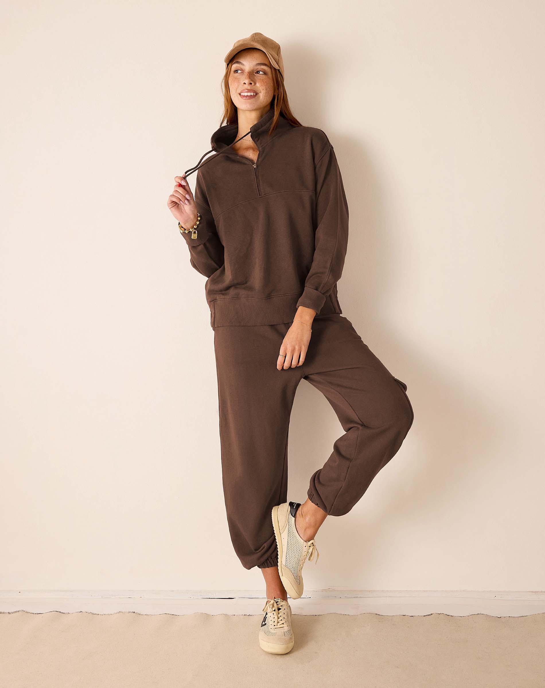 Espresso brown knit half-zip pullover and matching jogger set.
