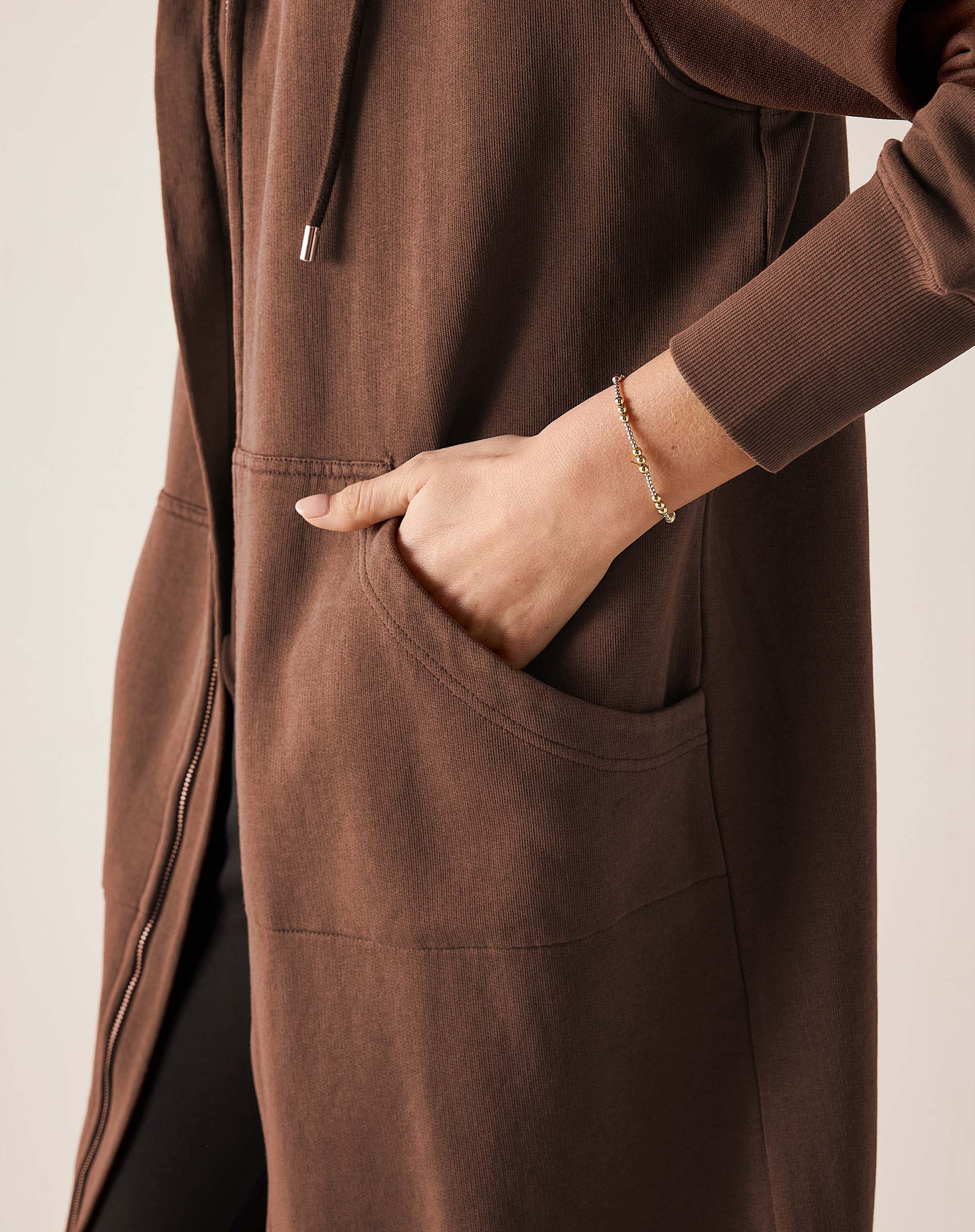 Espresso brown maxi hoodie with a front zipper and large patch pockets.