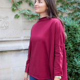 MERSEA women's travel-friendly winterberry mockneck tunic with long sleeves and a relaxed fit.