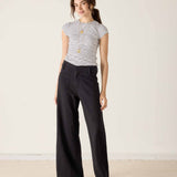 MERSEA ladies' travel-ready black wide-leg pants featuring a front patch pocket and relaxed fit.