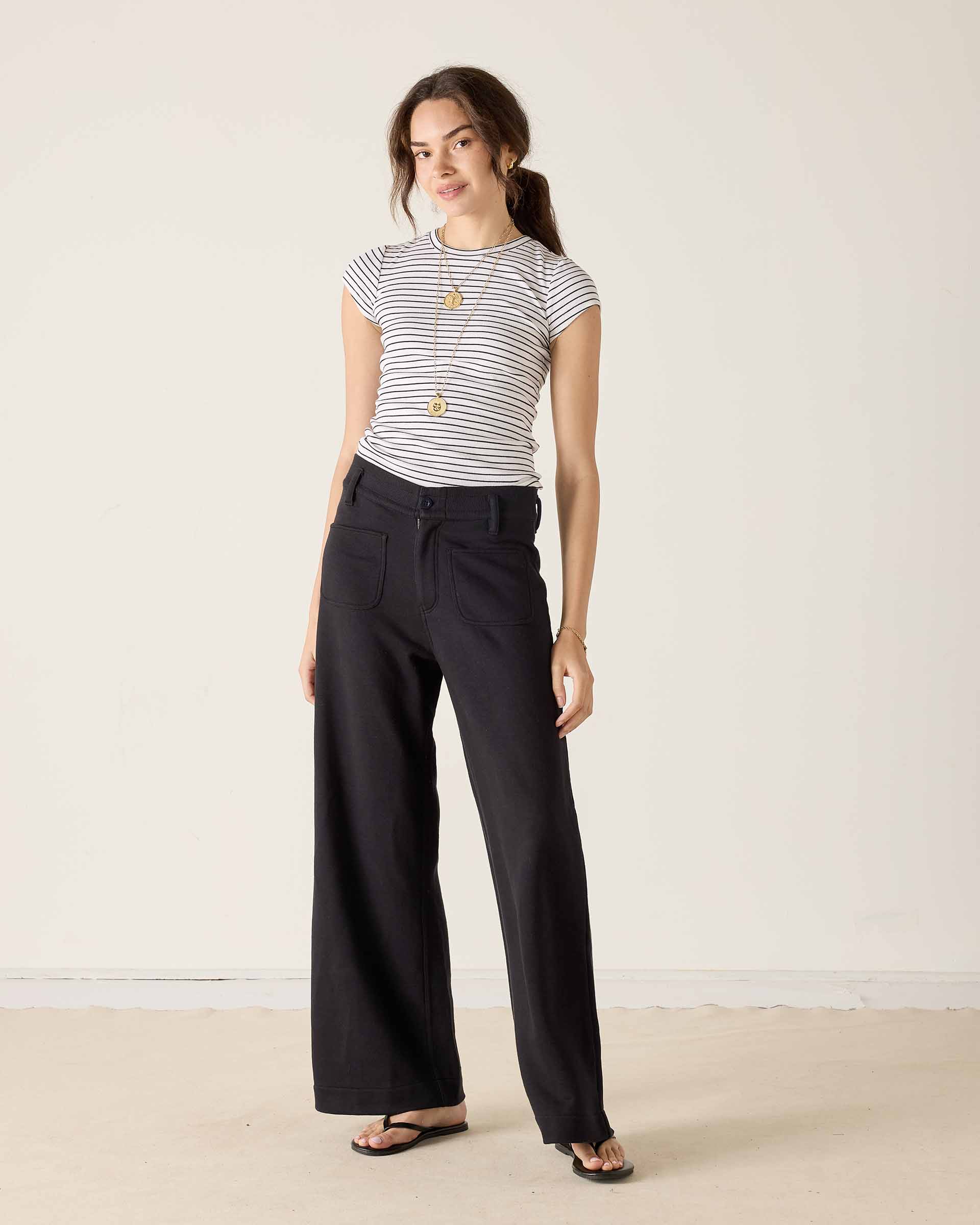 MERSEA ladies' travel-ready black wide-leg pants featuring a front patch pocket and relaxed fit.