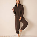 Espresso brown knit quarter-zip pullover with relaxed fit.