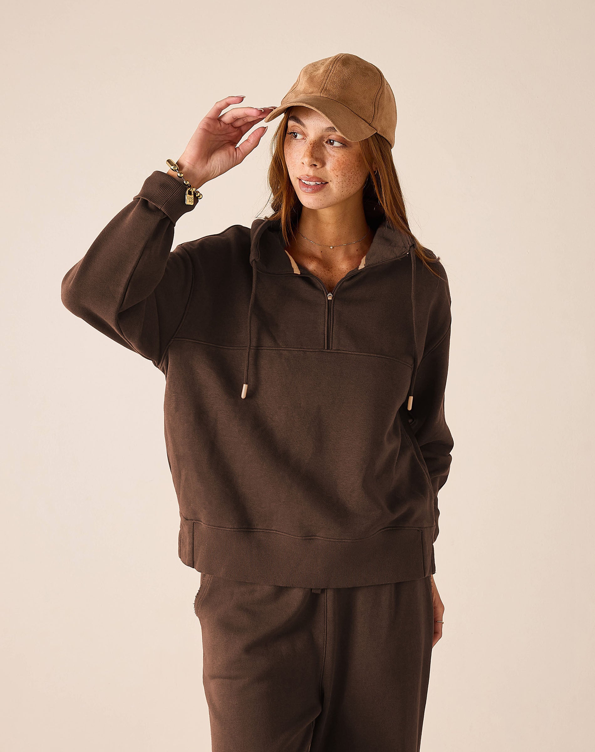 Espresso brown quarter-zip knit pullover with a cozy high neck.