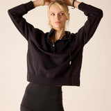 Black quarter-zip sweatshirt with a zip neck and drawstring hood.