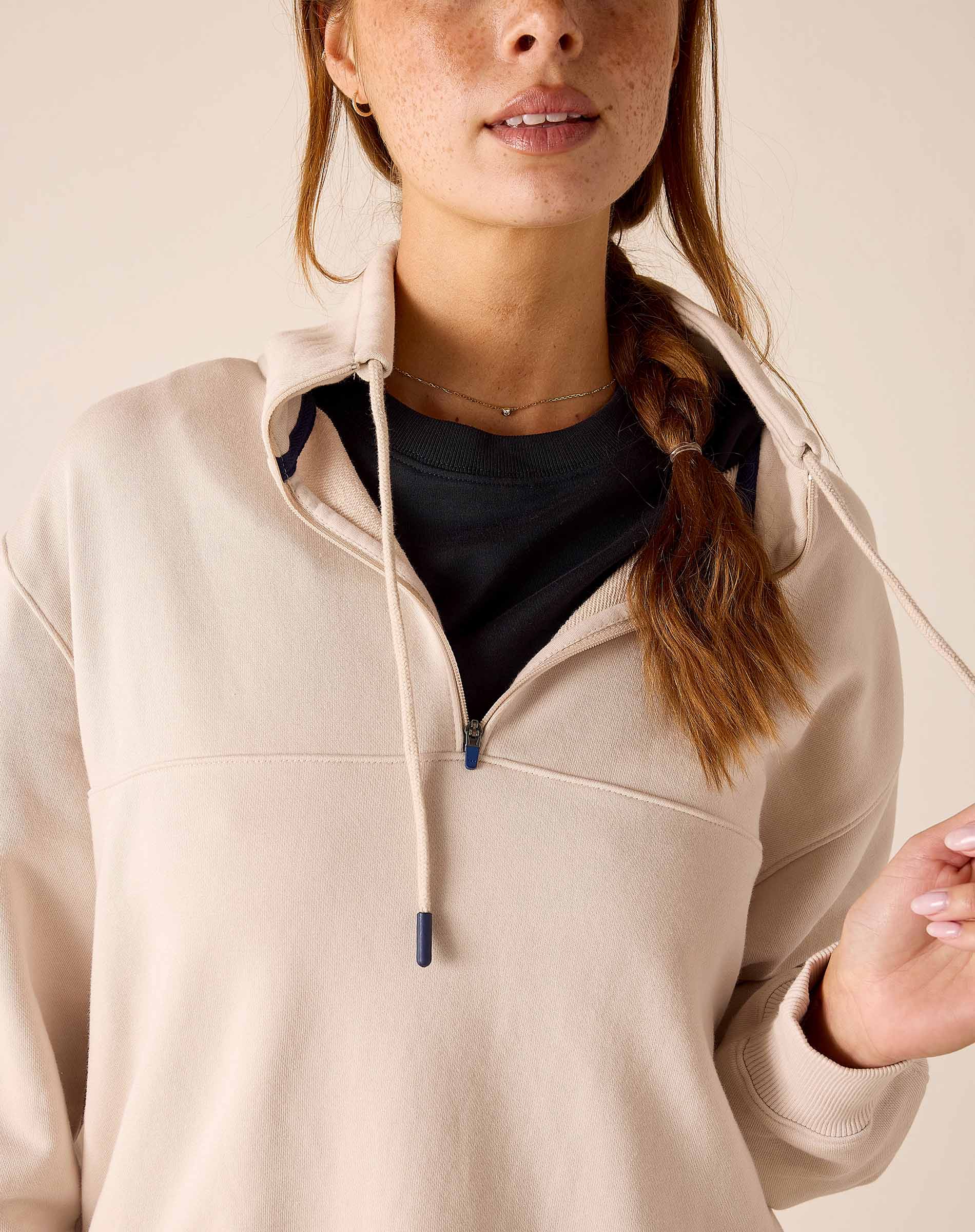 MERSEA ladies' travel-ready bone quarter-zip sweatshirt with a hood and drawstring.