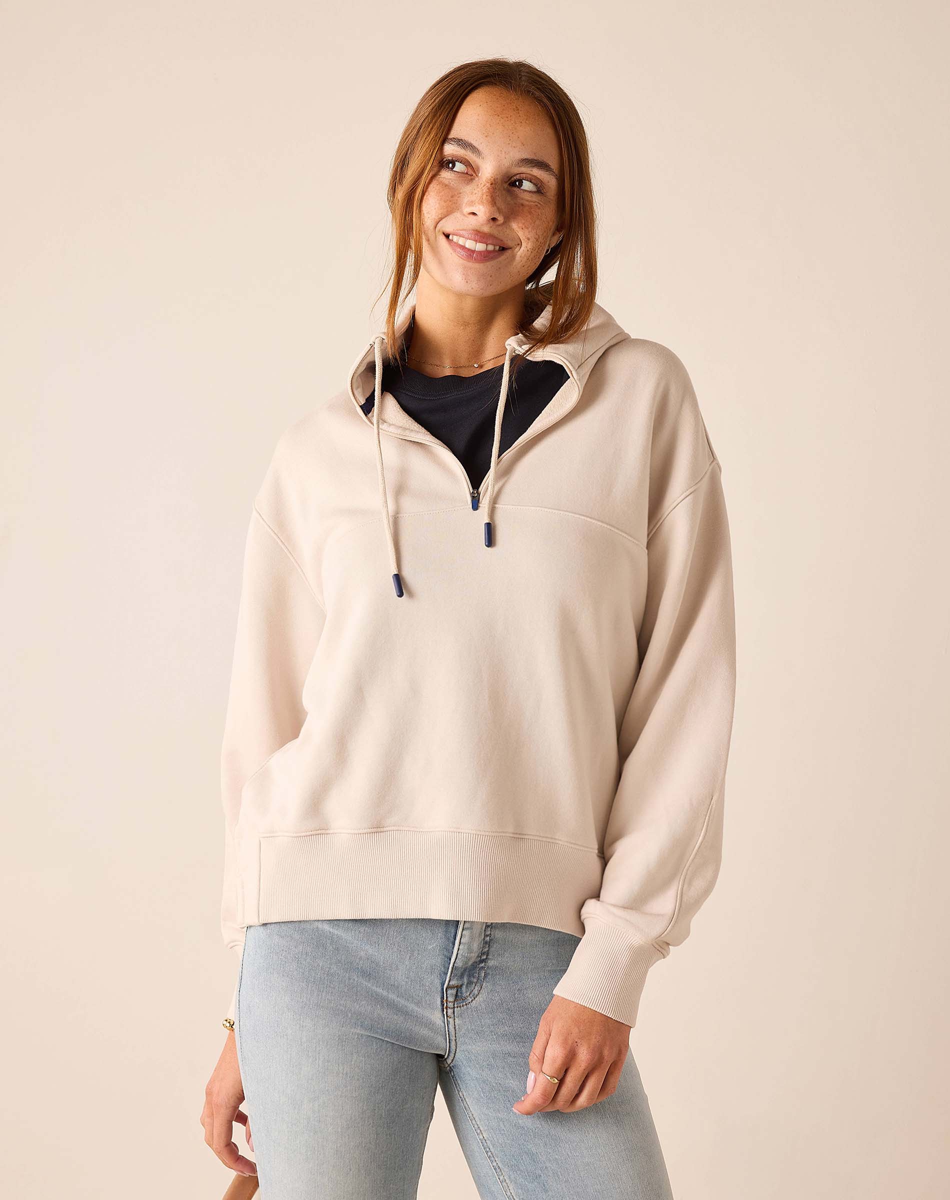 Bone quarter-zip sweatshirt with a hood and long sleeves