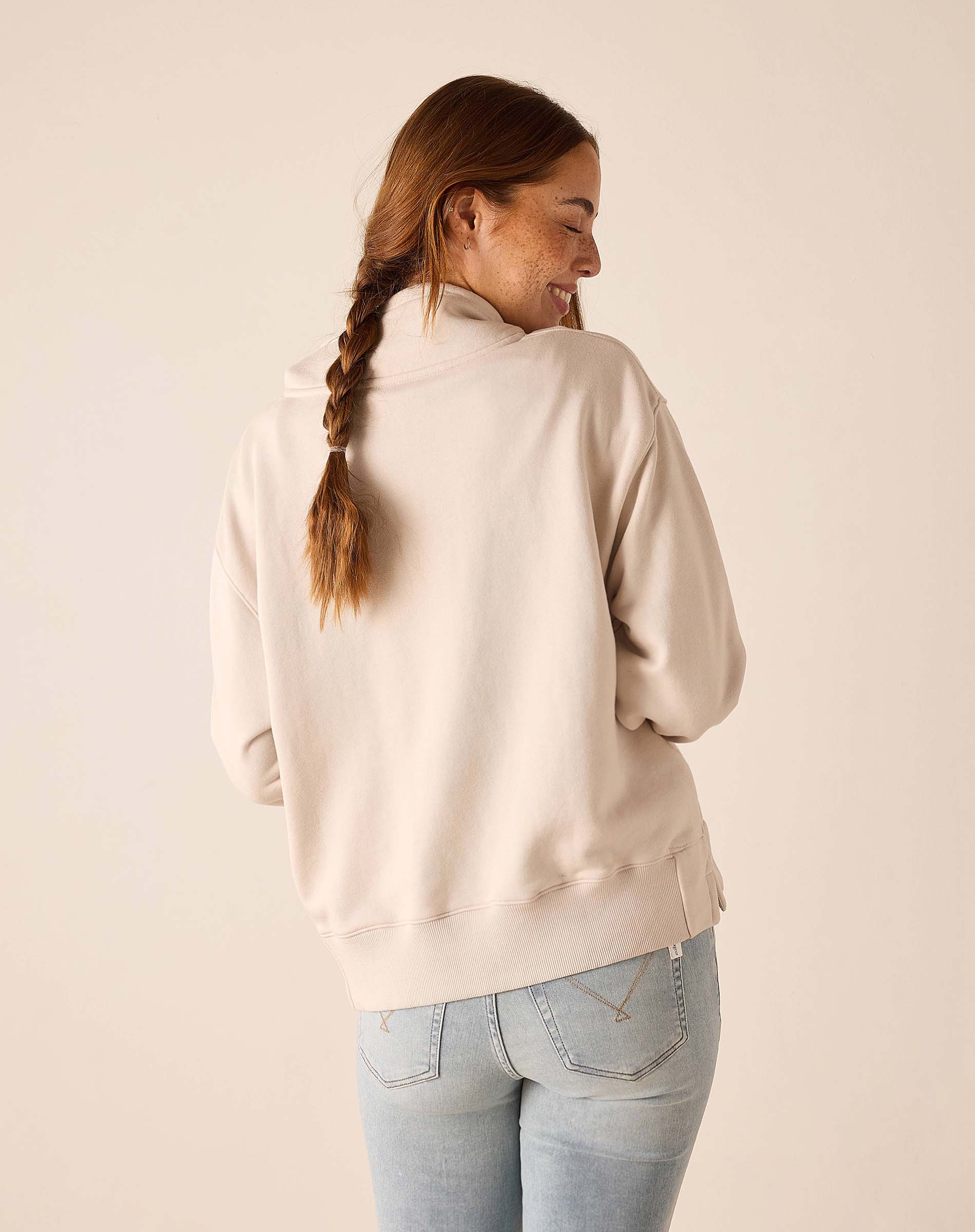 Bone quarter-zip sweatshirt with ribbed detailing.