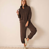 Espresso brown quarter-zip sweatshirt and matching joggers.