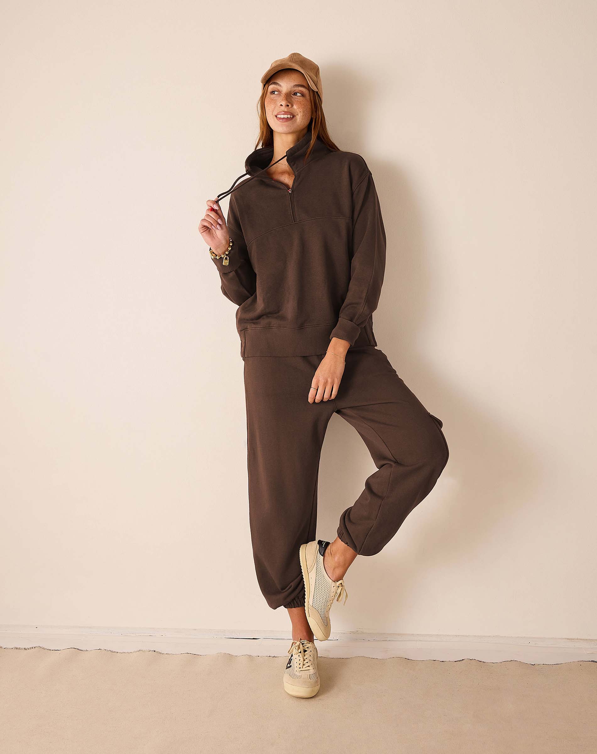 Espresso brown quarter-zip sweatshirt and matching joggers.