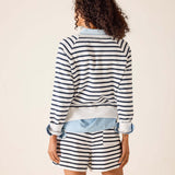 Person wearing a striped outfit with a white background