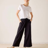 MERSEA women's travel-friendly black wide-leg trousers with an elasticated waist.